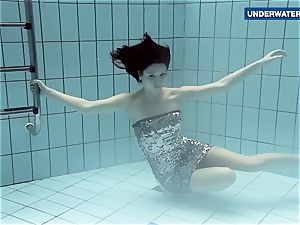 displaying bright milk cans underwater makes everyone kinky